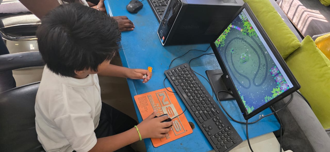 Student working on a computer during ICT class