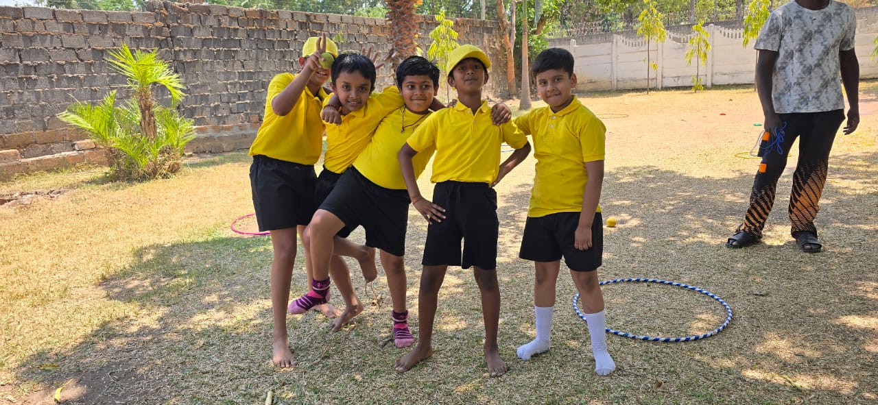 Young learners posing happily during sports day