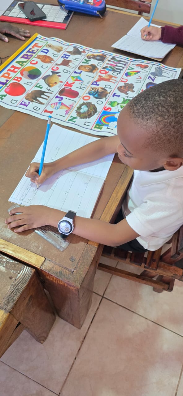 Young learner concentrating on handwriting practice